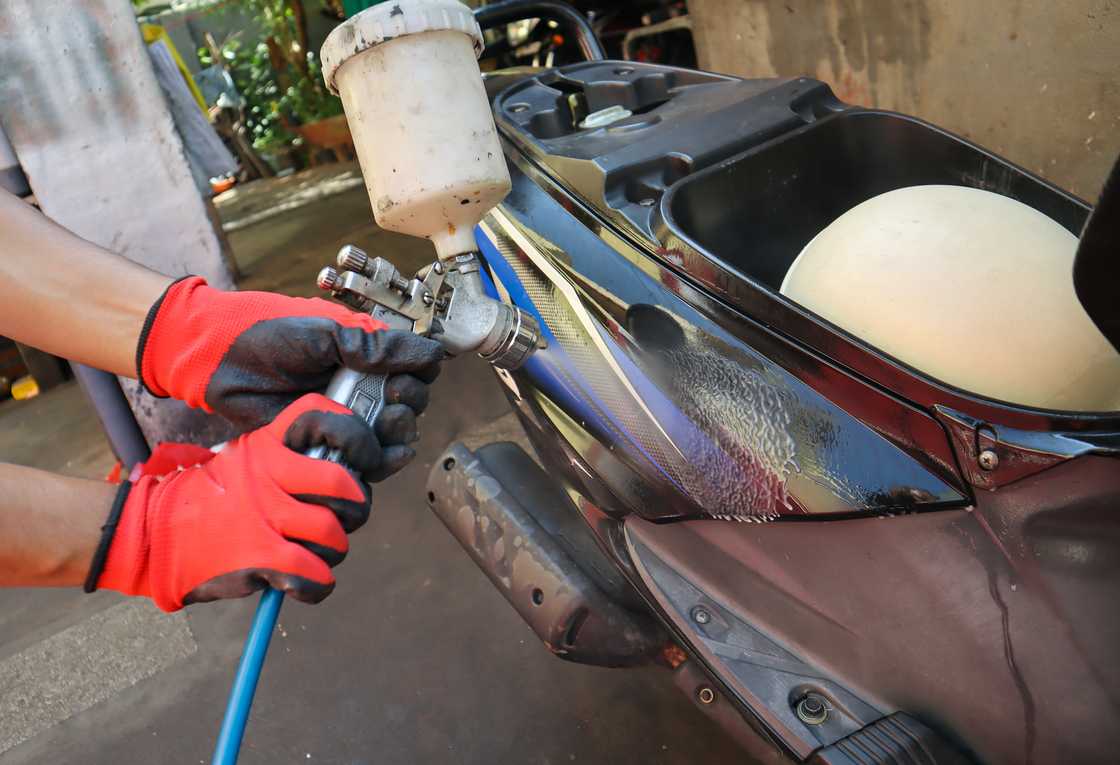 A man painting a bike