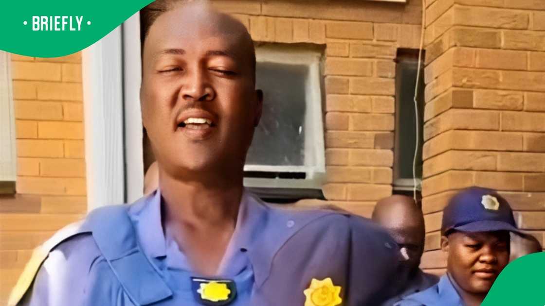 SAPS officer leads prayer with others