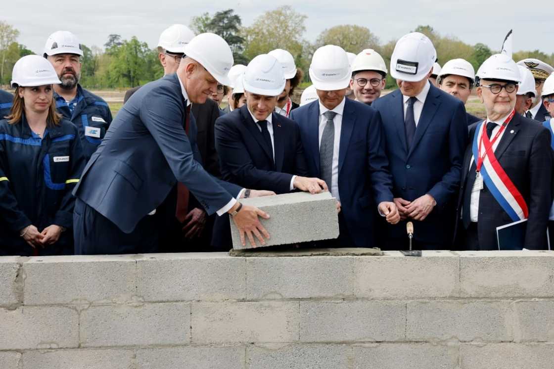 'Defence industries will play a growing role,' said French President Emmanuel Macron (centre)