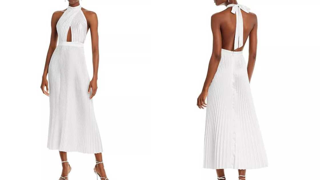 White A-line gown with pleats and a halter mock neck White A-line gown with pleats and a halter mock neck