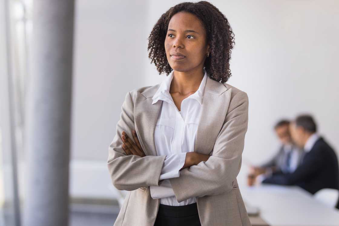 Confident black businesswoman standing Confident black businesswoman standing