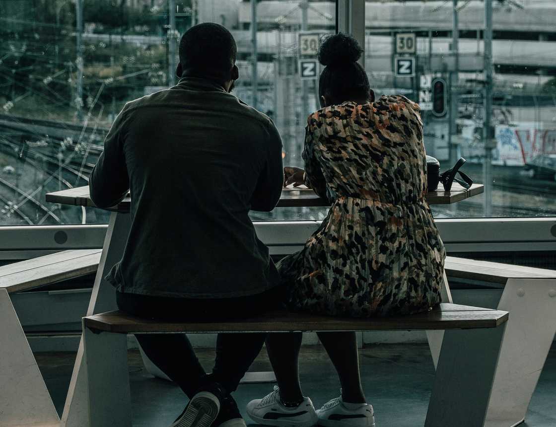 A couple sitting on a balcony A couple sitting on a balcony