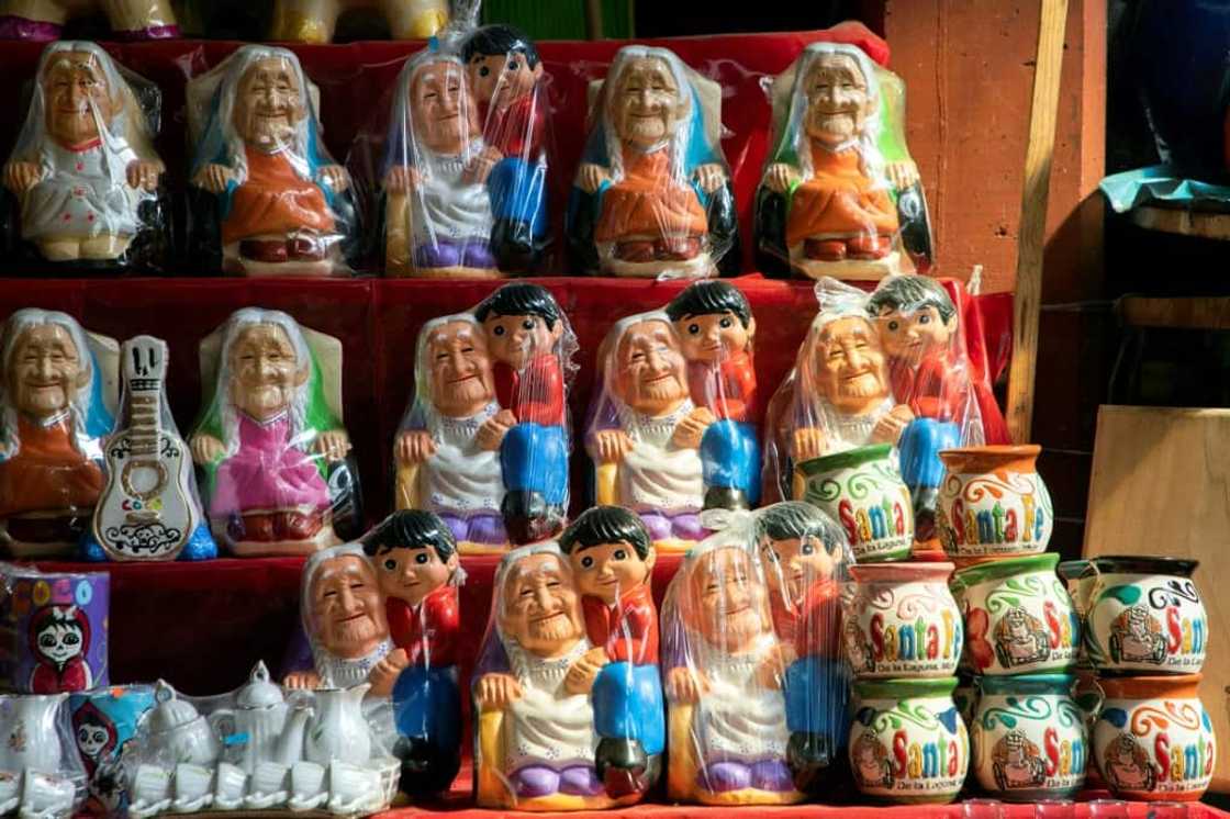Souvenirs on sale in Santa Fe de la Laguna, the hometown of the Mexican woman thought to have inspired "Mama Coco" Souvenirs on sale in Santa Fe de la Laguna, the hometown of the Mexican woman thought to have inspired "Mama Coco"