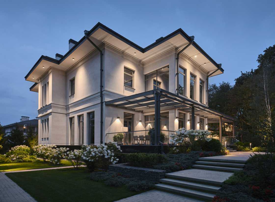 A peaceful neighbourhood, there stands a fancy double-story house that.