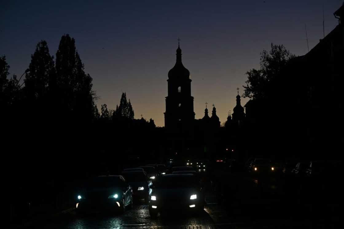 Following Monday's strikes, Kyiv was plunged into darkness overnight, with the only lights coming from cars on the road Following Monday's strikes, Kyiv was plunged into darkness overnight, with the only lights coming from cars on the road