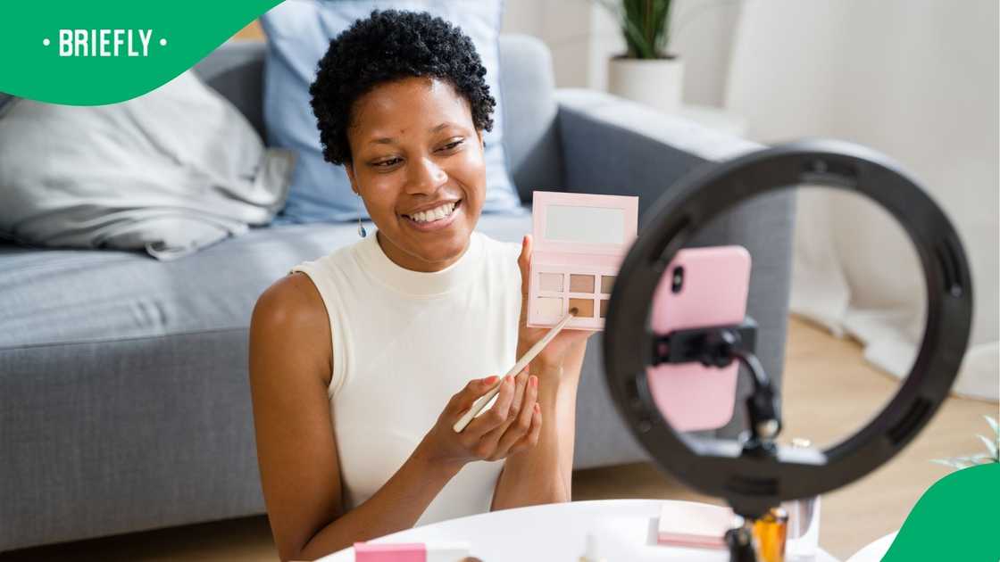 A stock photo content creator holding a beauty product A stock photo content creator holding a beauty product