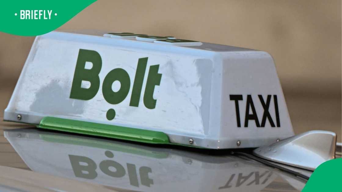 Bolt taxi sign is seen on a car.