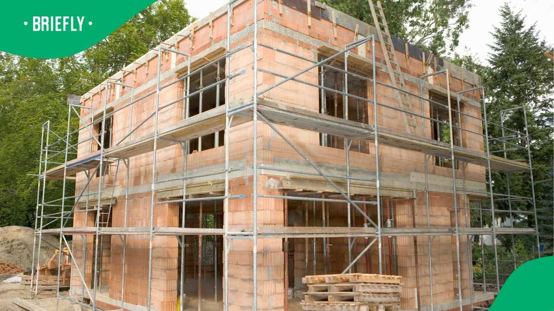 A stock photo of a house being constructed A stock photo of a house being constructed