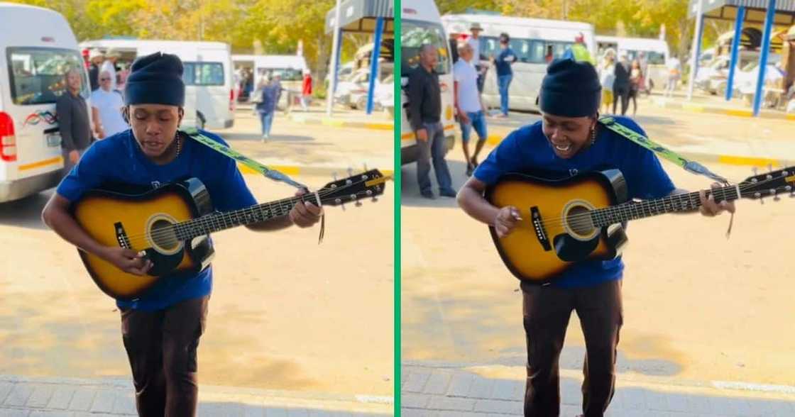 A man played his guitar and sang at the taxi rank A man played his guitar and sang at the taxi rank