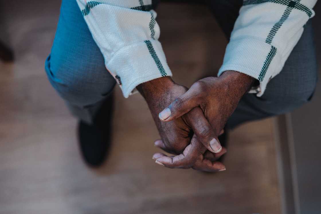 An elderly man waiting in hospital line