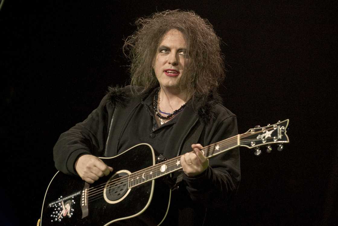 Robert Smith of The Cure playing the guitar at the O2 Arena in London Robert Smith of The Cure playing the guitar at the O2 Arena in London