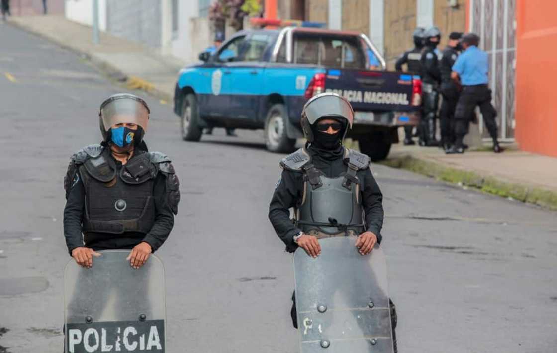 Nicaraguan police block the entrance of Matagalpa's Archbishop Curia on August 4, preventing bishop Rolando Alvarez from leaving Nicaraguan police block the entrance of Matagalpa's Archbishop Curia on August 4, preventing bishop Rolando Alvarez from leaving