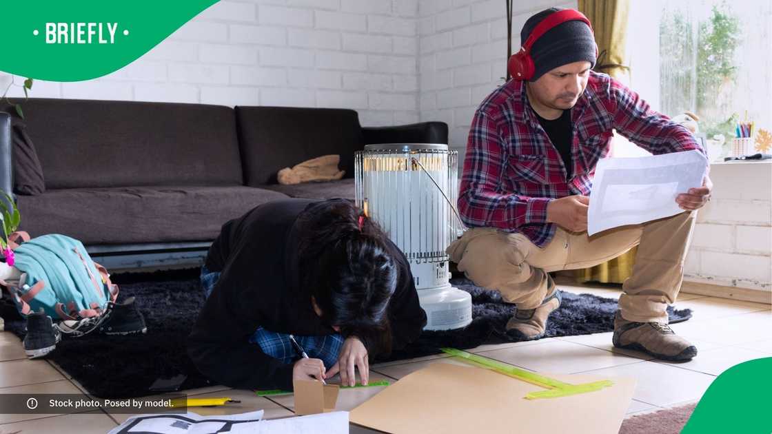 Parent completing a school project. Parent completing a school project.
