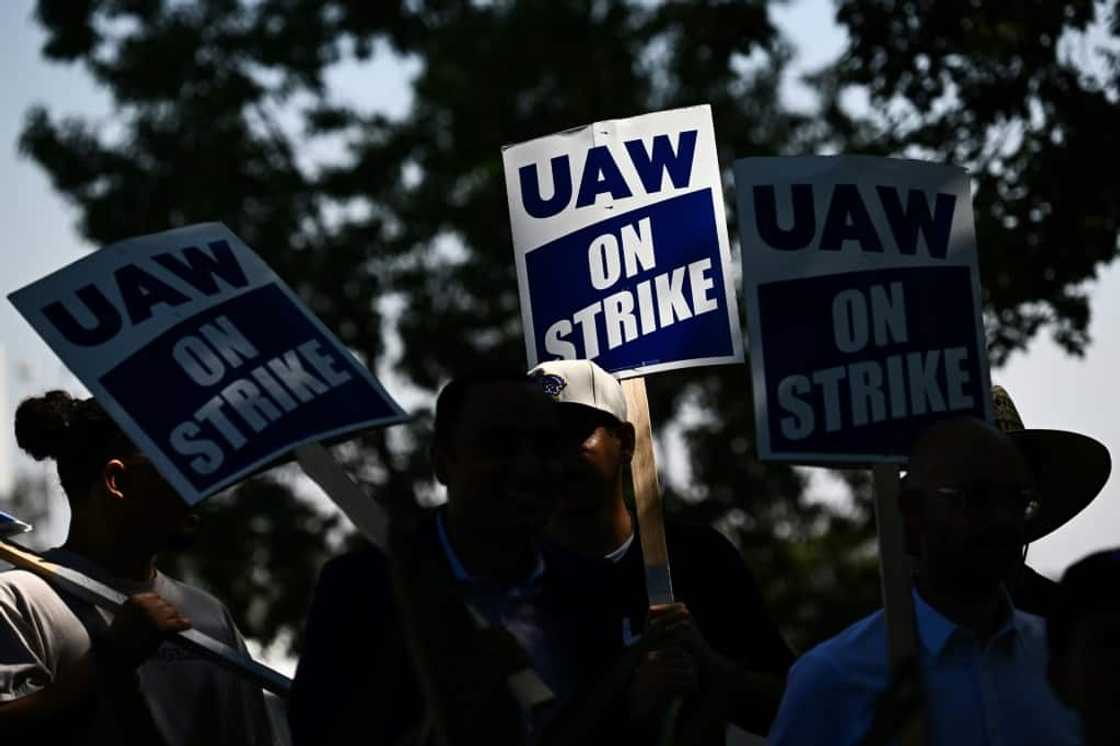 Members of the United Auto Workers (UAW) Local 230 and their supporters walk the picket line in front of the Chrysler Corporate Parts Division in Ontario, California, on September 26, 2023, to show solidarity for the "Big Three" autoworkers on strike Members of the United Auto Workers (UAW) Local 230 and their supporters walk the picket line in front of the Chrysler Corporate Parts Division in Ontario, California, on September 26, 2023, to show solidarity for the "Big Three" autoworkers on strike