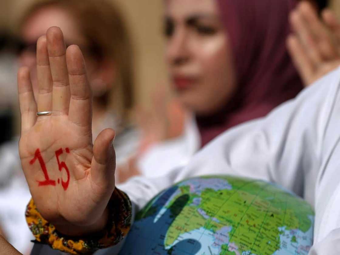 Protesters demand the world stick to the target of limiting the global temperature rise to 1.5 degrees Celsius from pre-industrial levels Protesters demand the world stick to the target of limiting the global temperature rise to 1.5 degrees Celsius from pre-industrial levels