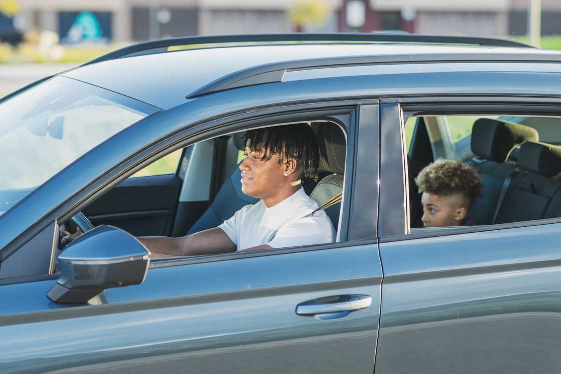 Father driving his son Father driving his son