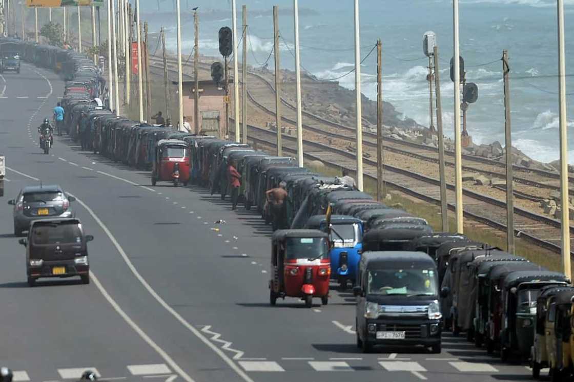 Emergency curfews, tear gas plumes and the sudden departure of the president have all failed to budge the long vehicle queues snaking out of Colombo's empty petrol station