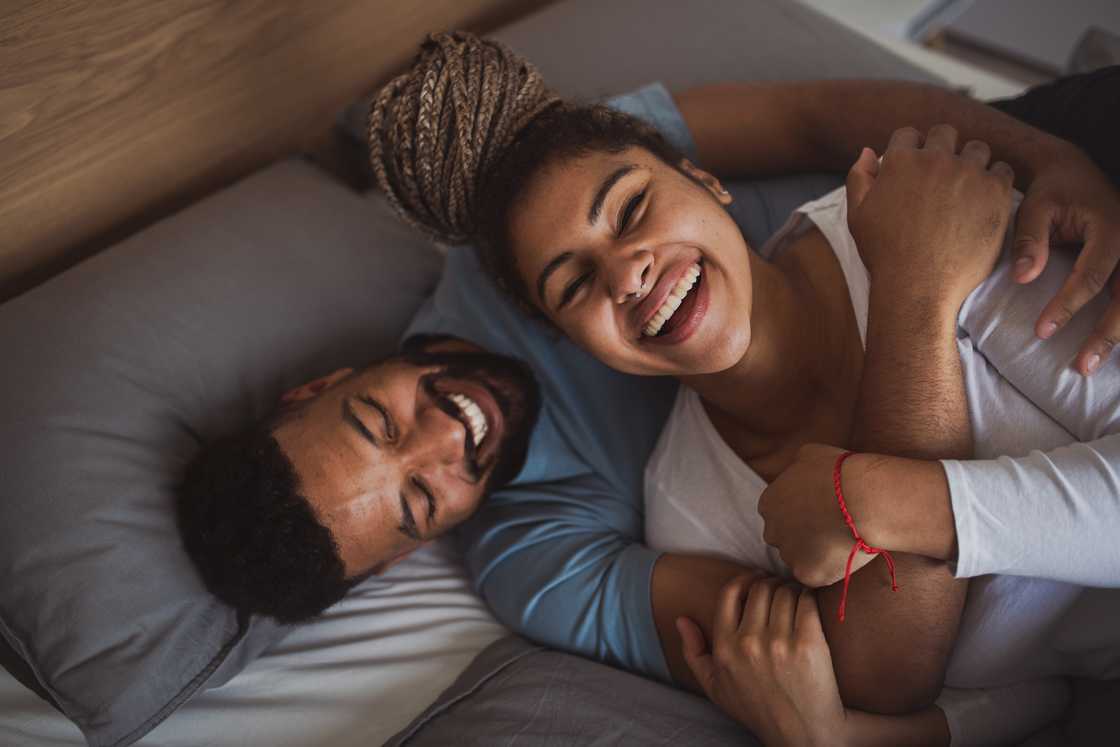 Black couple in love on bed Black couple in love on bed