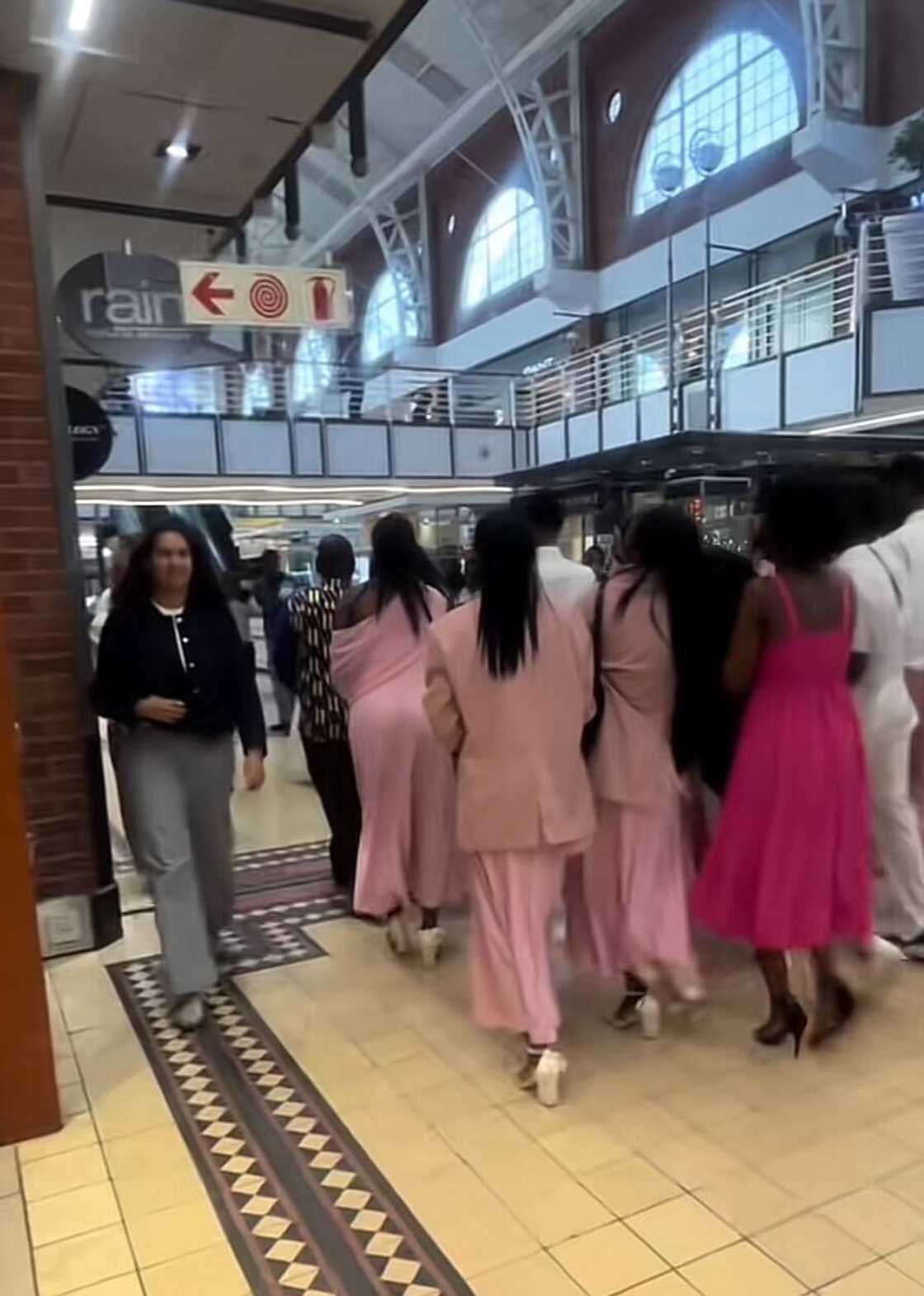 The newlywed couple captivated attention as the wedding party walked through a Cape Town mall. The newlywed couple captivated attention as the wedding party walked through a Cape Town mall.