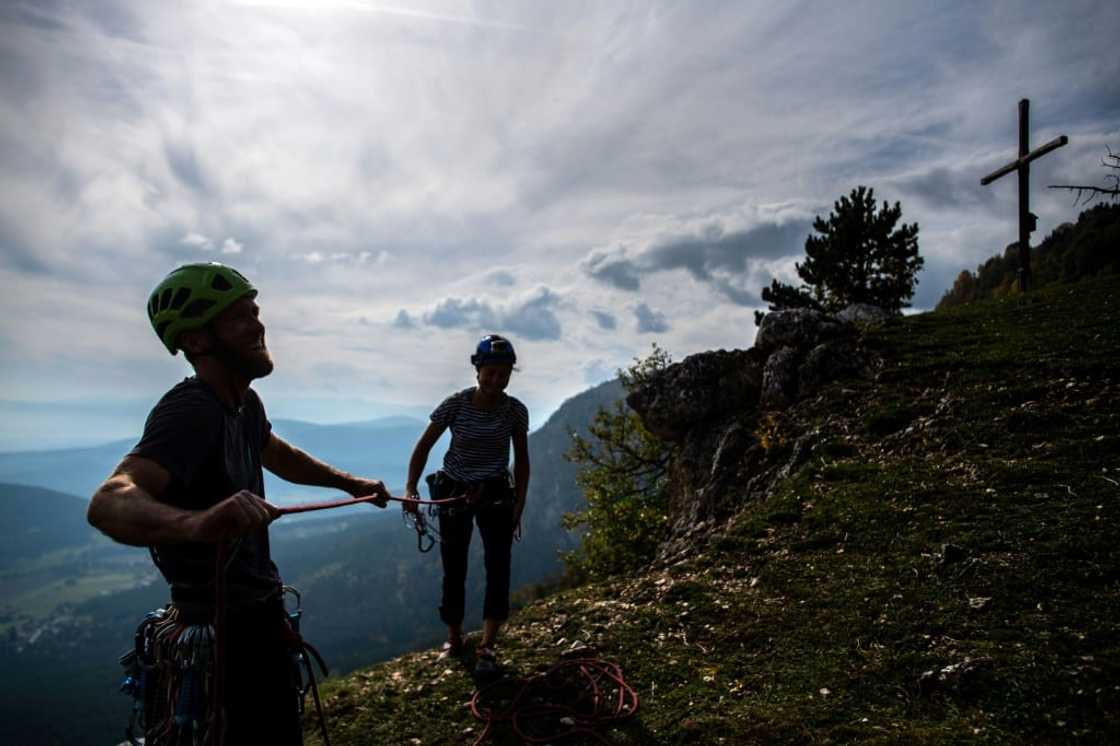 Climbers Daniel Kufner (left) and Joanna Geschev at the top of an Austrian route baptised 'Fortress Europe'