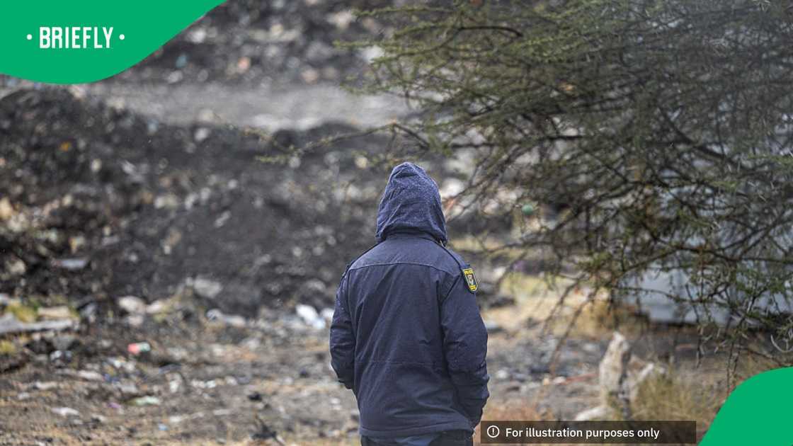 A South African Police Service (SAPS) officer stands guard near a mine shaft in Nkaneng near Marikana on August 11, 2026, where 14 illegal miners were found dead A South African Police Service (SAPS) officer stands guard near a mine shaft in Nkaneng near Marikana on August 11, 2026, where 14 illegal miners were found dead