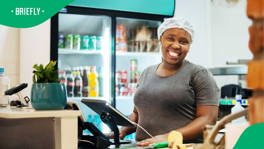 A shot of a cashier at work A shot of a cashier at work