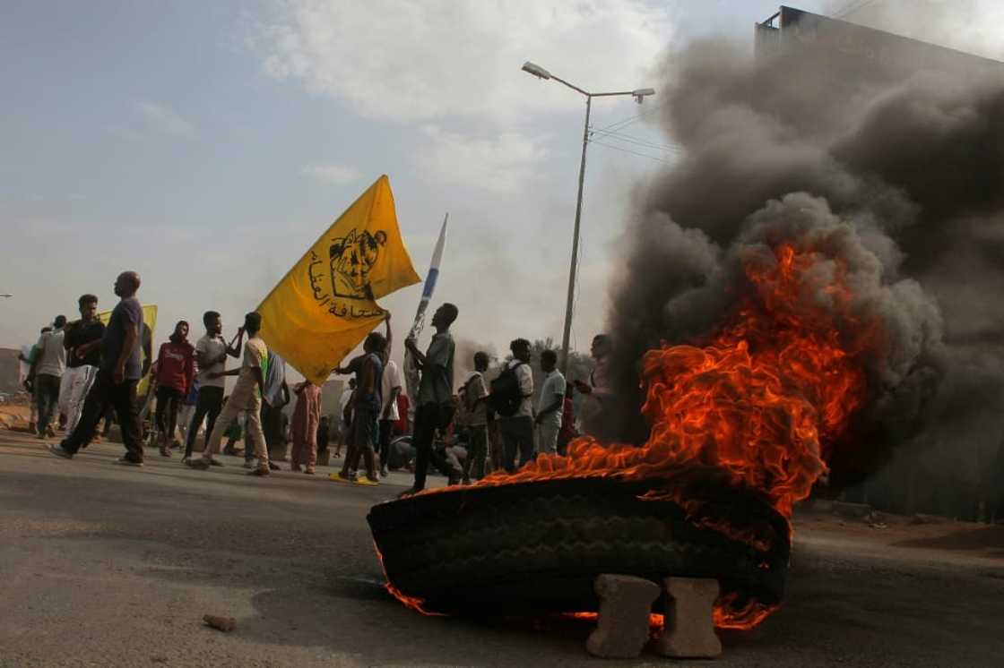 Sudanese protesters block a street in the capital Khartoum last week, as demonstrations against last year's coup persist Sudanese protesters block a street in the capital Khartoum last week, as demonstrations against last year's coup persist
