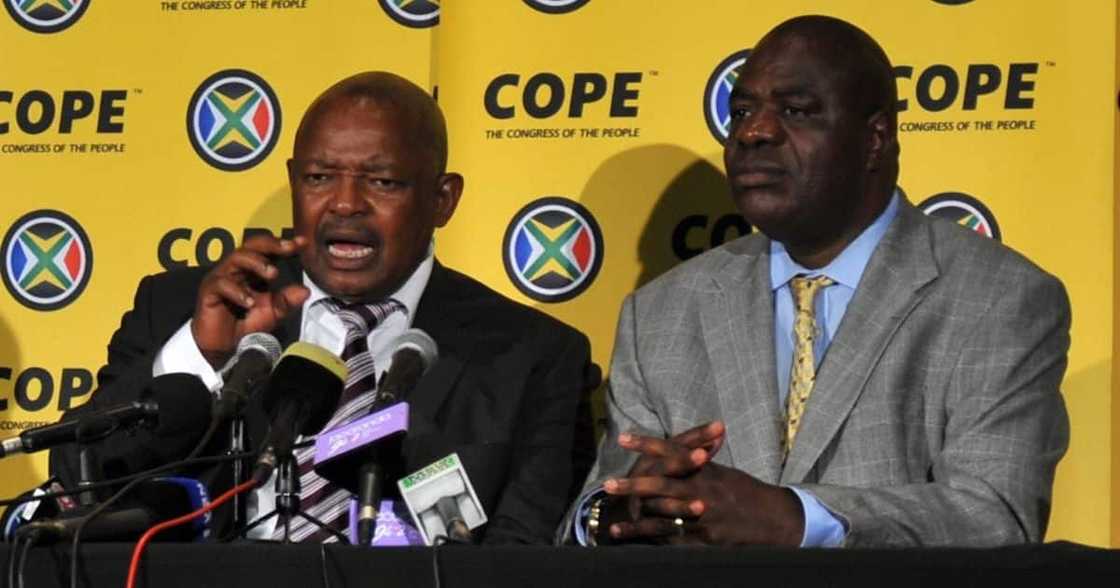 South African politician Mosiuoa Lekota (L) announces to form a new party 'Congress of the People'