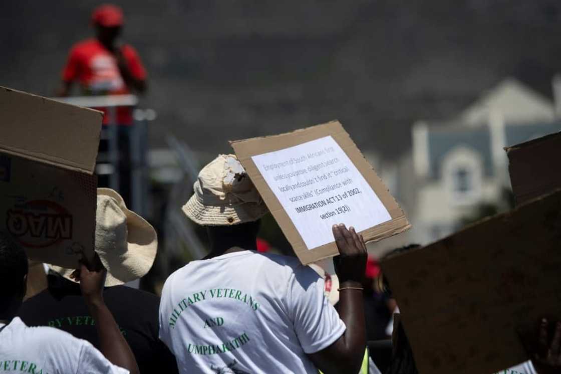 Protestors gathered outside Cape Town city hall ahead of the much-awaited speech Protestors gathered outside Cape Town city hall ahead of the much-awaited speech