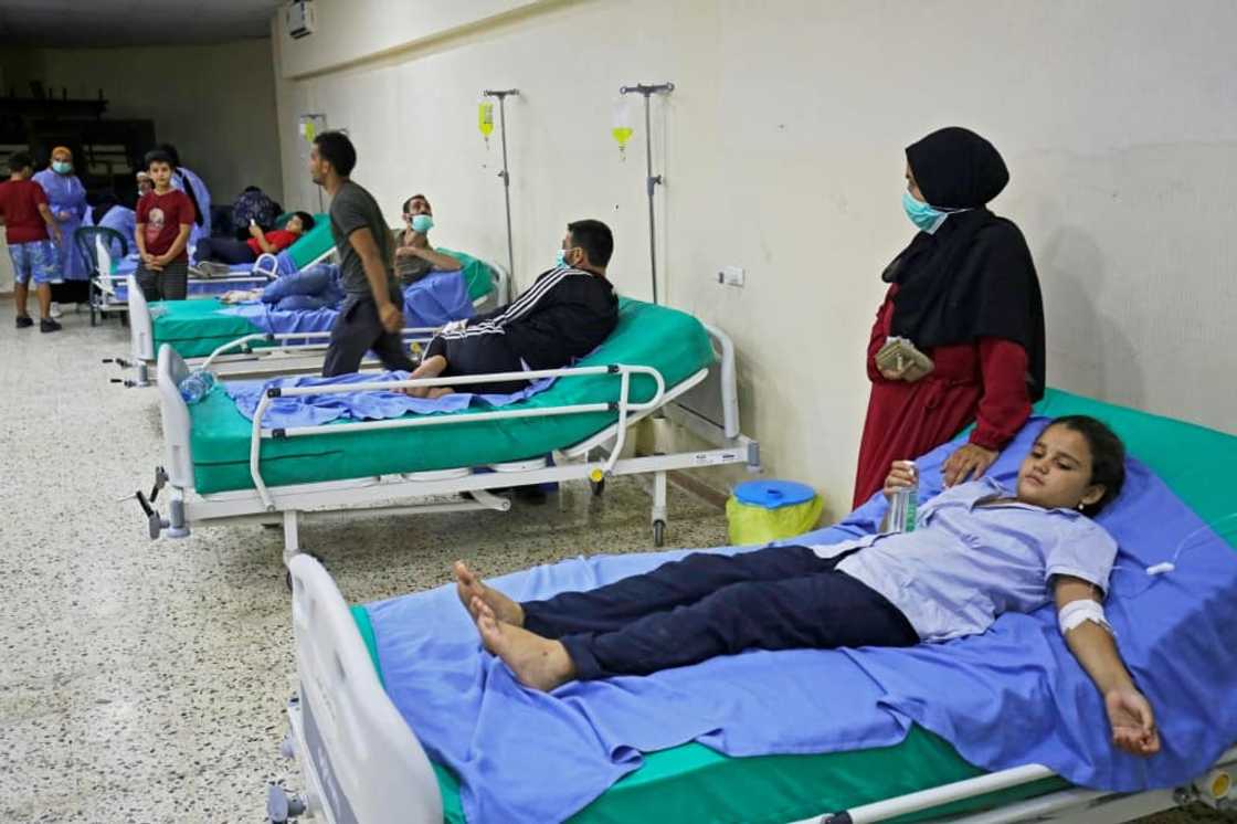 Patients receive treatment for Vibrio cholerae at a mosque hall converted into a field hospital in Bebnine, north Lebanon Patients receive treatment for Vibrio cholerae at a mosque hall converted into a field hospital in Bebnine, north Lebanon