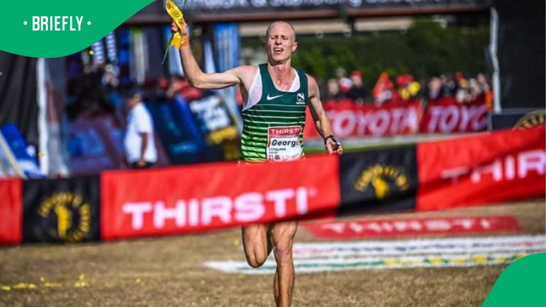 The action shot captured the moment the South African athlete broke through the red race banner to claim first place at the grueling marathon event The action shot captured the moment the South African athlete broke through the red race banner to claim first place at the grueling marathon event