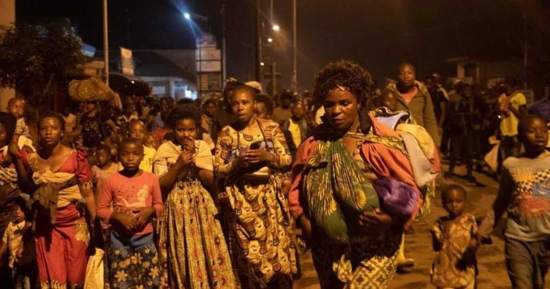 Thousands of panic-stricken residents carrying mattresses and other belongings fled the city. Photo: Getty Images.