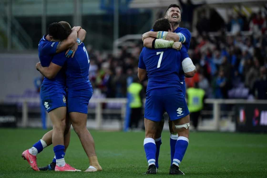 Italy's players celebrate their first victory over Australia Italy's players celebrate their first victory over Australia