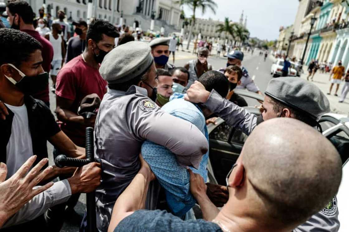 Cuban police detain an anti-government protester in this file photo from July 11, 2021