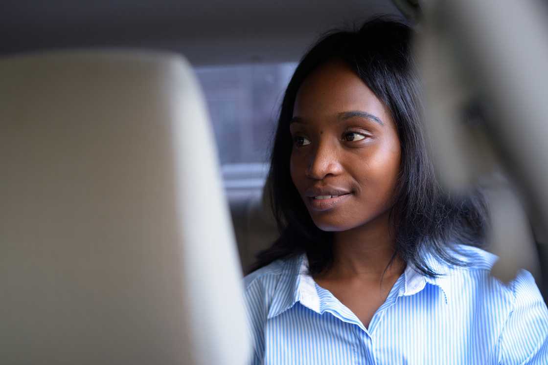 A lady in the back seat