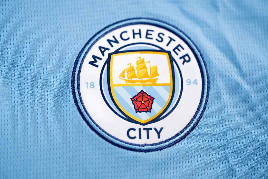 A detailed view of the badge of Manchester City FC A detailed view of the badge of Manchester City FC
