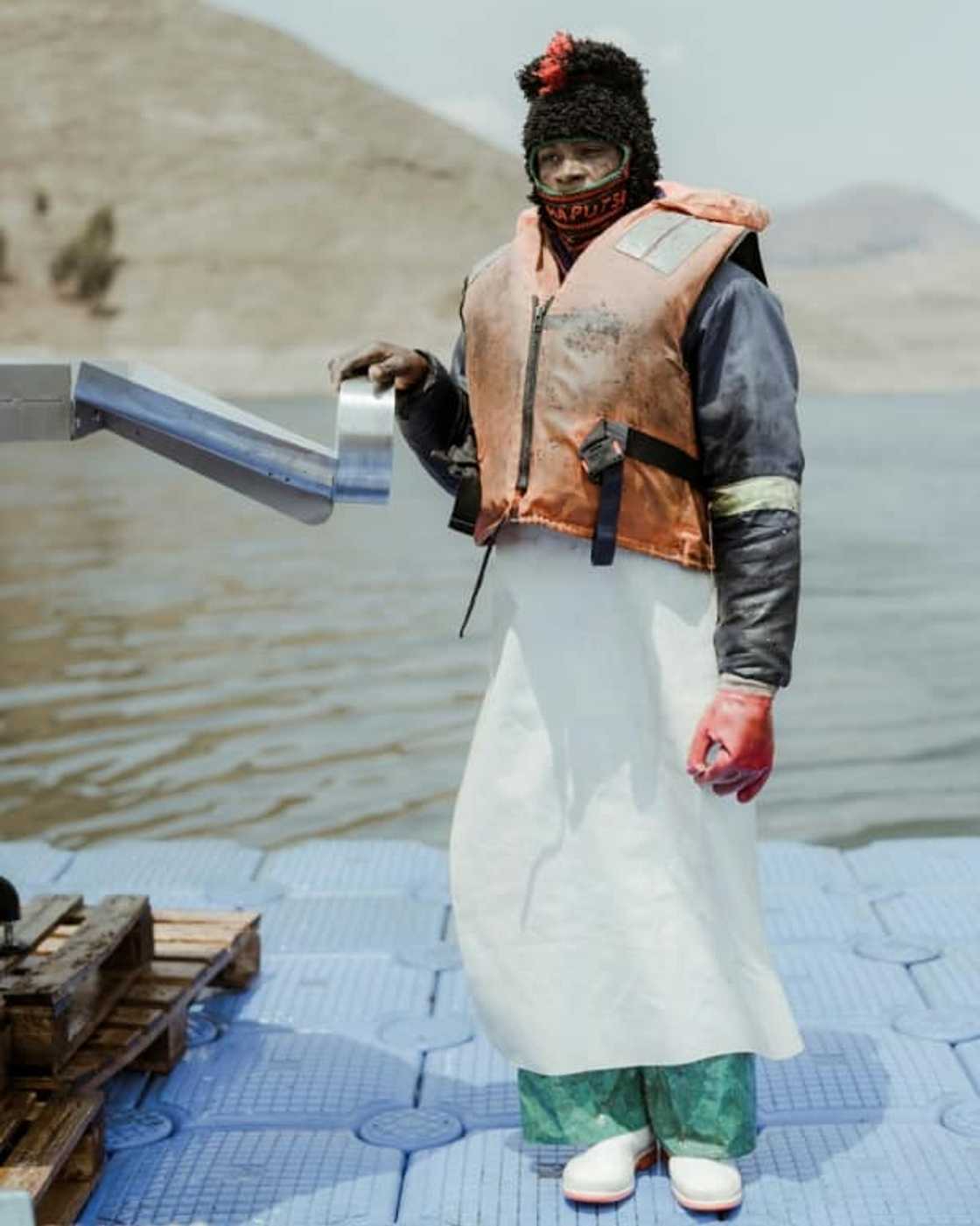 Dlodlo, a 26-year-old fish-farm worker, at the end of a day's harvesting