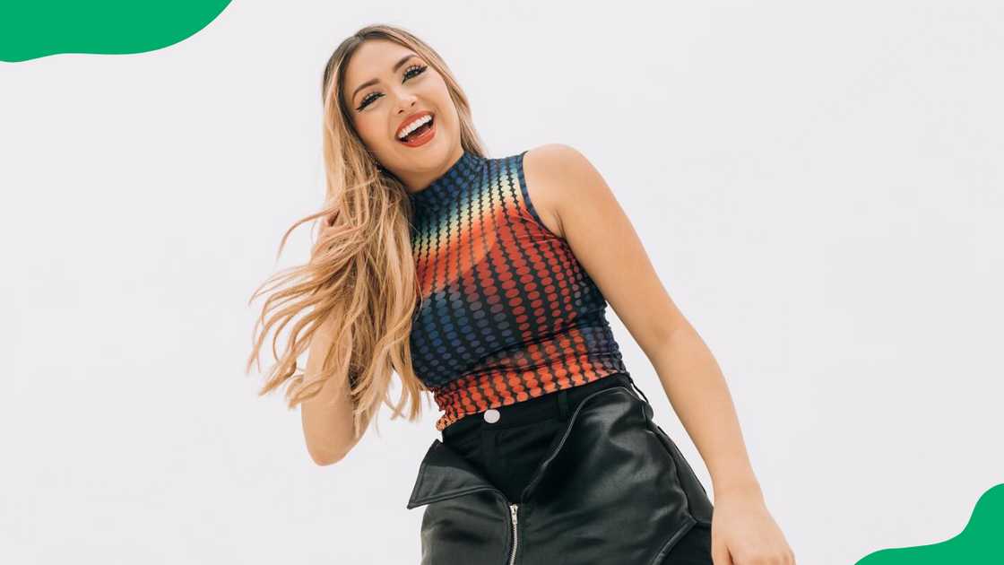AriGameplays on a coloured tank top and black skirt. AriGameplays on a coloured tank top and black skirt.