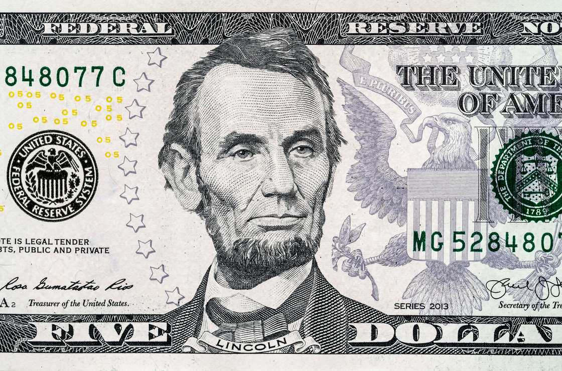 Close-up portrait of Abraham Lincoln on $500 bill.