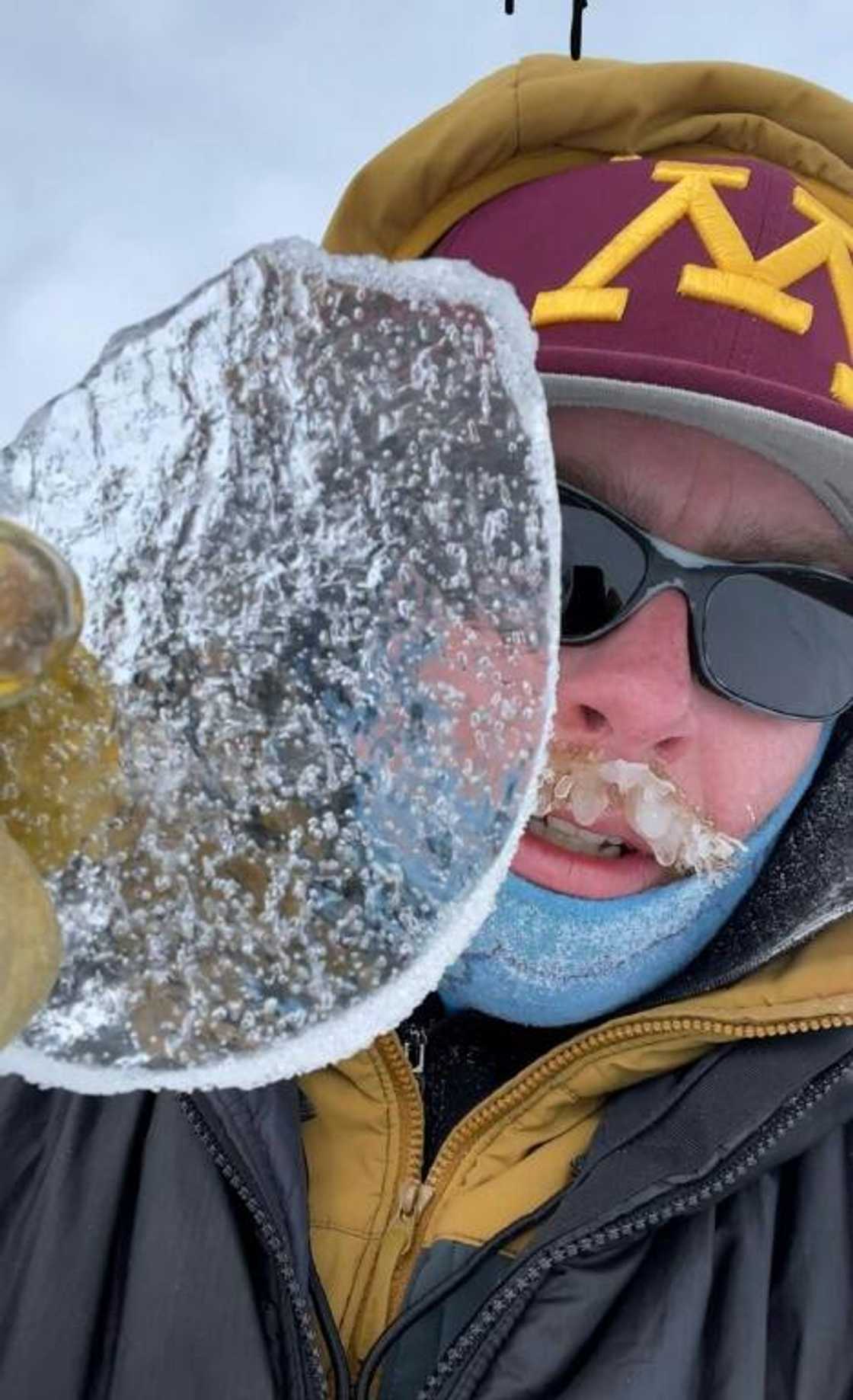 Glaciologist Peter Neff holds a fragment of Antarctic ice containing 100,000-year-old air bubbles