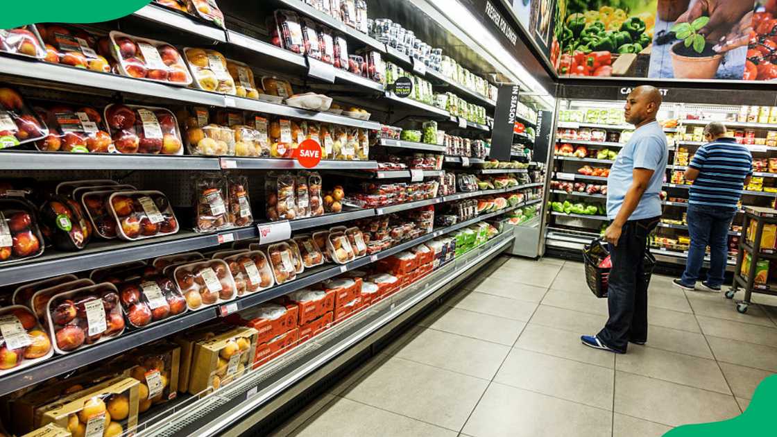 Customers shopping at a supermarket Customers shopping at a supermarket