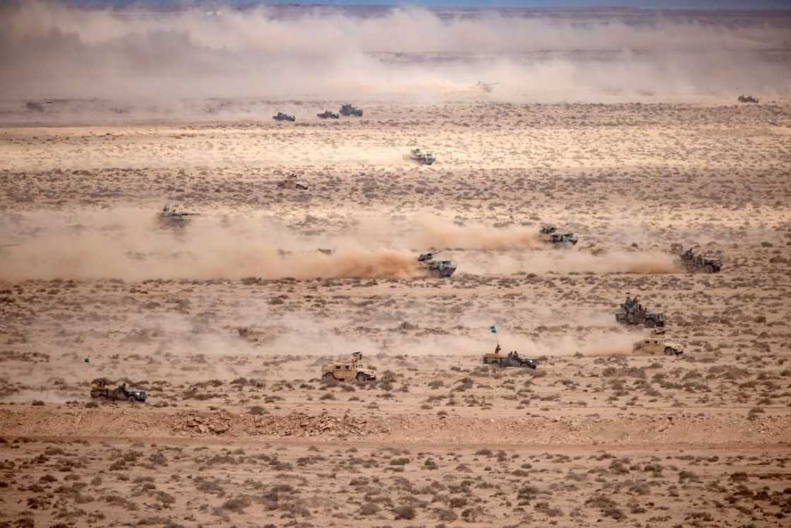 Troops simulated a joint land and air attack against enemy columns in a live fire exercise Troops simulated a joint land and air attack against enemy columns in a live fire exercise