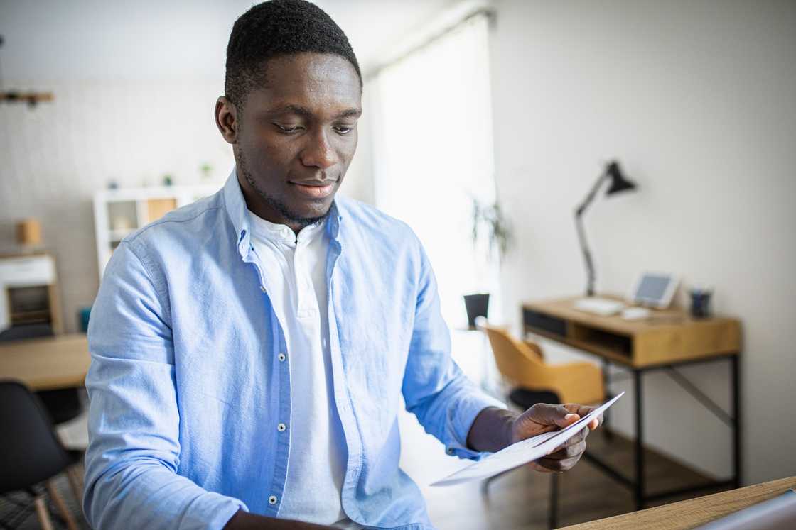 Man carrying an envelope Man carrying an envelope