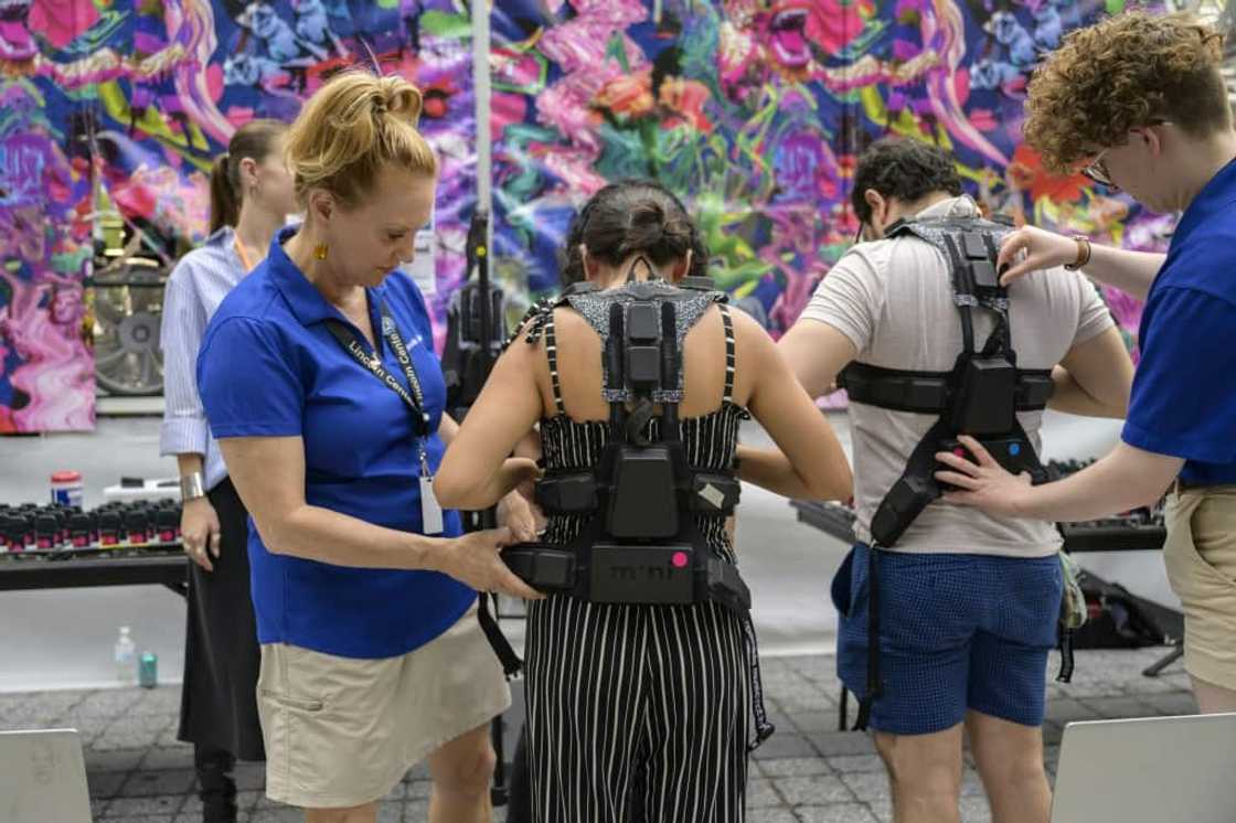 Concertgoers get fitted for haptic suits that translate music to the body through vibrations Concertgoers get fitted for haptic suits that translate music to the body through vibrations