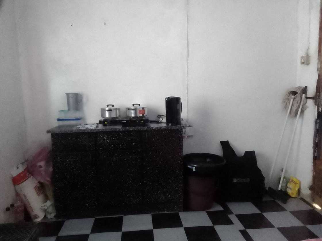 21-year-old man shows his kitchen area.