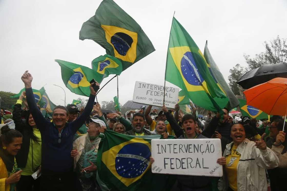 Supporters of President Jair Bolsonaro take part in a protest in the centre of Rio de Janeiro demanding the army helps prevent Luiz Inacio Lula da Silva taking power Supporters of President Jair Bolsonaro take part in a protest in the centre of Rio de Janeiro demanding the army helps prevent Luiz Inacio Lula da Silva taking power