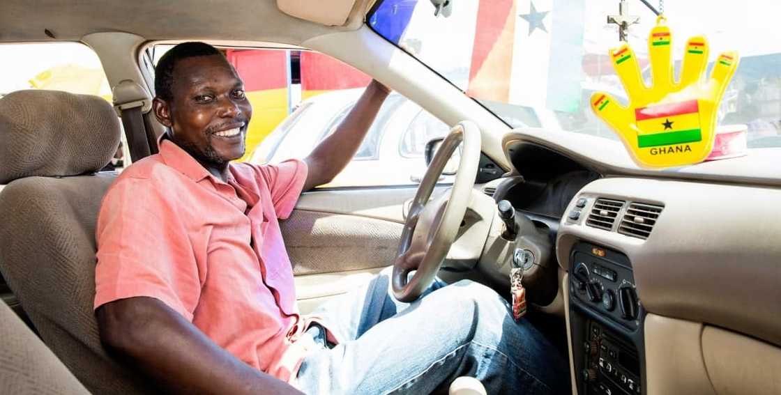 Ghanaian driver looking happy Ghanaian driver looking happy
