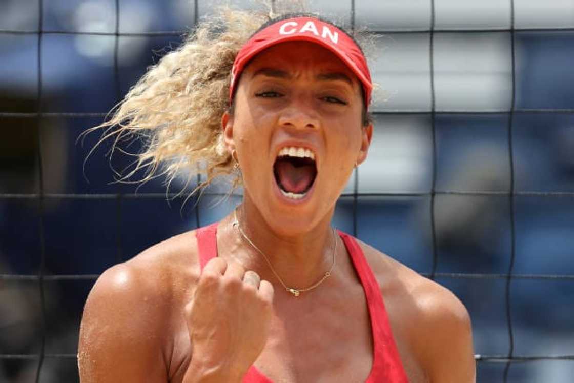 Brandie Wilkerson celebrates during the Women's Preliminary - Pool C beach volleyball