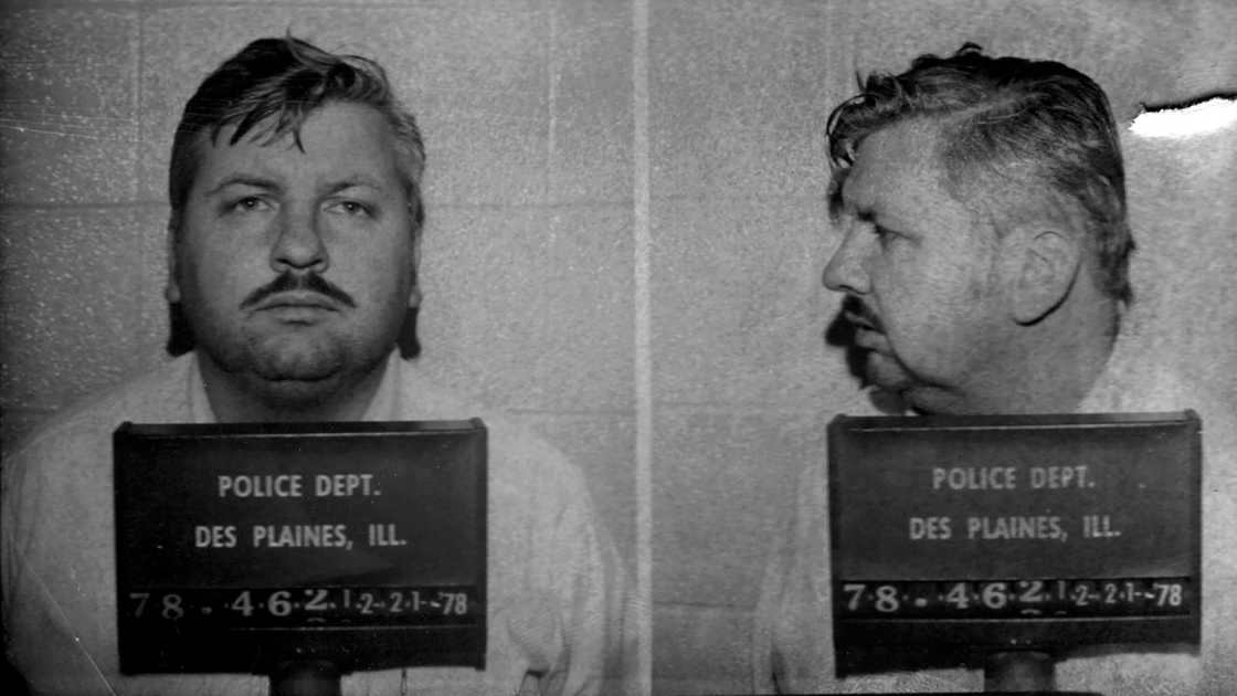 John Wayne Gacy posing for his mug shot John Wayne Gacy posing for his mug shot