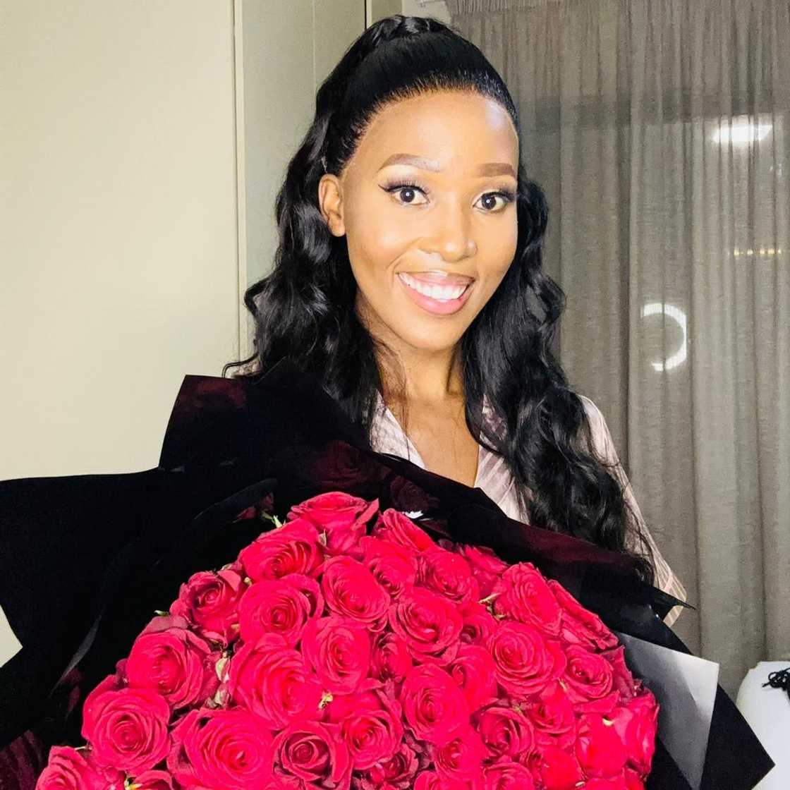 A woman with a bouquet of flowers.